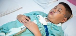 Asian boy wearing Sleep Apnea Diagnostic medical device Kit